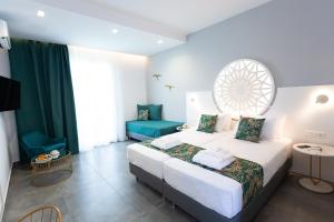 Ein Bett oder Betten in einem Zimmer der Unterkunft Likio Studios