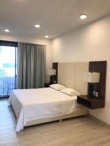 Postel nebo postele na pokoji v ubytování Estudio Cerca del mar, en Puerto Aventuras #201