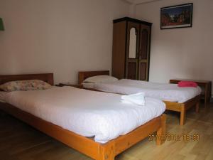 Postel nebo postele na pokoji v ubytování Le Rhododendron Chambres D'hotes