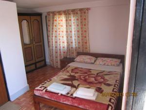 Cama ou camas em um quarto em Le Rhododendron Chambres D'hotes