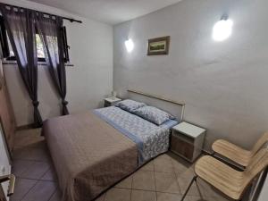 Postel nebo postele na pokoji v ubytování APP Carla