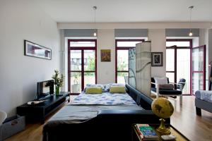 a living room with a bed and a couch at Porto Terrace Apartment in Porto