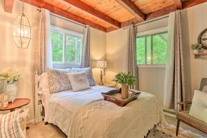 a bedroom with a bed and a window at Deck and Pool Access Welcoming Poconos Retreat in Tobyhanna
