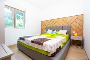 Postel nebo postele na pokoji v ubytování Apartman DULY LUX