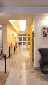 a hallway of a hospital with tables and chairs at Hotel Laguna Residence in Marghera