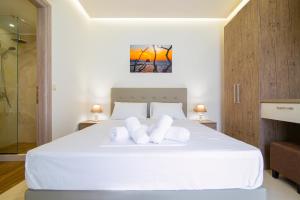 Postel nebo postele na pokoji v ubytování Amara Residences by Estia