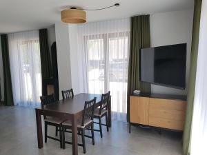 TV a/nebo společenská místnost v ubytování Apartmány Jura
