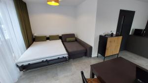 Postel nebo postele na pokoji v ubytování Apartmány Jura
