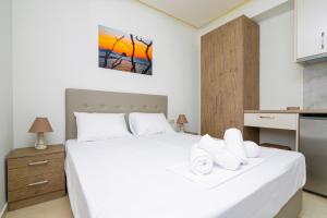 Postel nebo postele na pokoji v ubytování Amara Residences by Estia