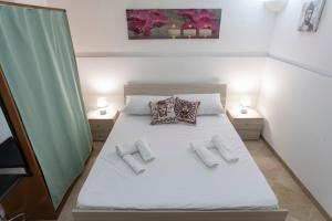 Ein Bett oder Betten in einem Zimmer der Unterkunft Appartamenti Leonarda
