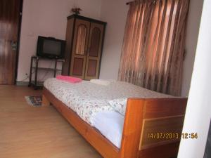 Postel nebo postele na pokoji v ubytování Le Rhododendron Chambres D'hotes