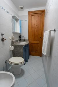 Ein Badezimmer in der Unterkunft Appartamenti Leonarda
