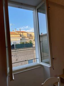 a window in a room with a view of a building at Senigallia Loft La ContEsSa in Senigallia