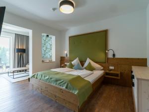 Łóżko lub łóżka w pokoju w obiekcie Hotel Streklhof