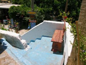 a set of stairs with a bench on top at The Water Mill Cottage in Lagoúdi Zía
