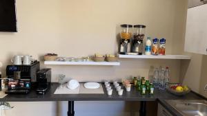 Kuchyň nebo kuchyňský kout v ubytování B&B Leus Appartment