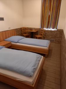 Postel nebo postele na pokoji v ubytování Hotel Pribitzer