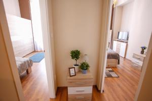 Posteľ alebo postele v izbe v ubytovaní Uránia Apartmanház