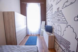 Posteľ alebo postele v izbe v ubytovaní Uránia Apartmanház