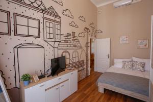 Posteľ alebo postele v izbe v ubytovaní Uránia Apartmanház