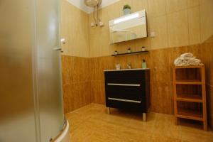 Kúpeľňa v ubytovaní Uránia Apartmanház