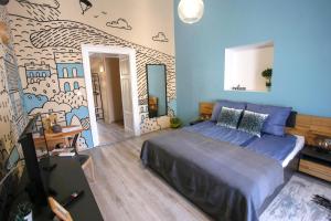 Posteľ alebo postele v izbe v ubytovaní Uránia Apartmanház