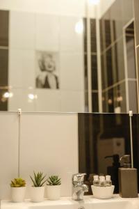 Kúpeľňa v ubytovaní Uránia Apartmanház