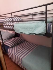 Postel nebo postele na pokoji v ubytování Apartman" Afrodita"