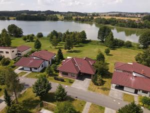 an aerial view of a house with a lake at Obora 824 in Nová Bystřice