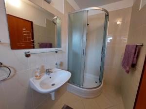 a bathroom with a shower and a sink at Apartment Jure in Primošten +29 photos