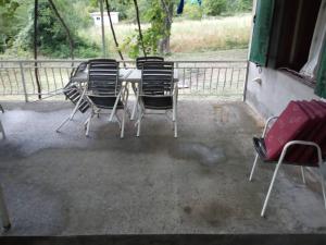 a group of chairs sitting around a table at Smještaj Elena in Budva