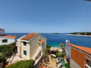 an aerial view of a building and the ocean at Apartment Jure in Primošten