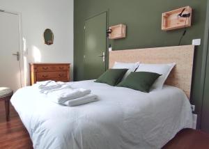Ein Bett oder Betten in einem Zimmer der Unterkunft La Maison d'Ingénieur