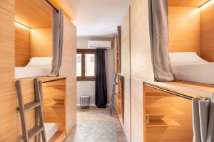 a room with a bed and a window at El Josemari Youth Hostel - Albergue Juvenil in Palma de Mallorca
