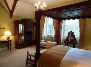 a bedroom with a large bed and a living room at Westgate Manor in Westgate