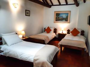 Ένα ή περισσότερα κρεβάτια σε δωμάτιο στο Hotel Mesón de los Virreyes