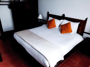 Ένα ή περισσότερα κρεβάτια σε δωμάτιο στο Hotel Mesón de los Virreyes