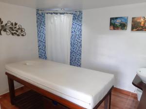 Ένα ή περισσότερα κρεβάτια σε δωμάτιο στο Hotel Mesón de los Virreyes