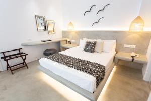 Ein Bett oder Betten in einem Zimmer der Unterkunft Likio Studios