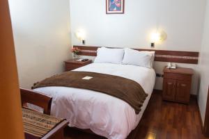 Postel nebo postele na pokoji v ubytování Antawasi Hotel