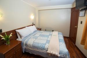 Postel nebo postele na pokoji v ubytování Antawasi Hotel