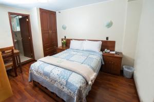 Postel nebo postele na pokoji v ubytování Antawasi Hotel