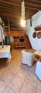 a room with a table and chairs and a ceiling at Traditional House in Skiros