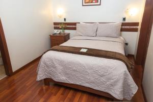 Postel nebo postele na pokoji v ubytování Antawasi Hotel