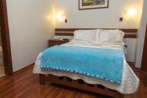 Postel nebo postele na pokoji v ubytování Antawasi Hotel