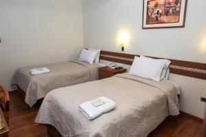 Postel nebo postele na pokoji v ubytování Antawasi Hotel