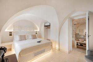 A bed or beds in a room at Masseria Villa Verde