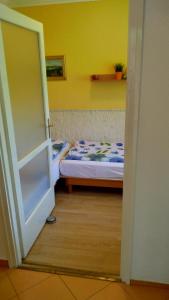 Postel nebo postele na pokoji v ubytování Candy apartman Siófok + 10 fotografií