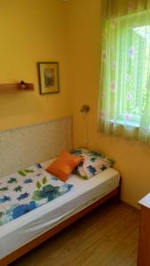 Postel nebo postele na pokoji v ubytování Candy apartman Siófok