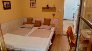 Postel nebo postele na pokoji v ubytování Candy apartman Siófok